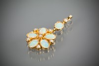 Lot 1148 - OPAL FLOWER PENDANT set with oval opals and...