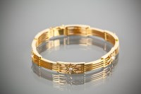 Lot 1154 - NINE CARAT GOLD PEARL SET BRACELET with star...