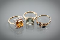 Lot 1157 - GROUP OF THREE GEM SET DRESS RINGS comprising...