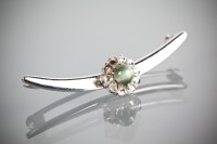 Lot 1171 - GREEN CAT'S EYE GEM AND DIAMOND CRESCENT...