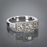 Lot 1177 - ART DECO STYLE DIAMOND THREE STONE RING the...