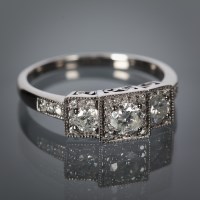 Lot 1178 - ART DECO STYLE DIAMOND THREE STONE RING the...