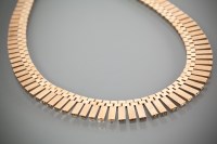 Lot 1181 - NINE CARAT GOLD NECKLACE c.1970s, with...