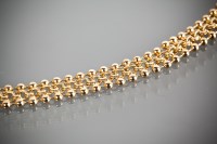 Lot 1197 - EIGHTEEN CARAT GOLD BRACELET formed by...