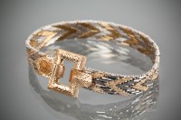 Lot 1198 - NINE CARAT GOLD BI-COLOUR BRACELET with...