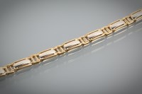 Lot 1206 - NINE CARAT GOLD BI COLOUR BRACELET formed by...