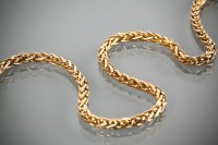 Lot 1208 - NINE CARAT GOLD NECKLACE of rope twist form,...