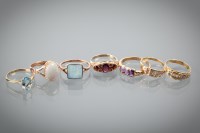 Lot 1215 - SEVEN GOLD GEM SET DRESS RINGS including a...