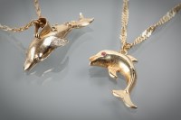 Lot 1284 - TWO GOLD DOLPHIN MOTIF PENDANTS one set with...