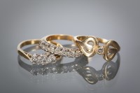 Lot 1285 - THREE EIGHTEEN CARAT GOLD DIAMOND SET RINGS...