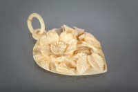 Lot 1299 - LARGE CARVED IVORY PENDANT the heart shaped...