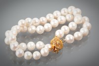 Lot 1307 - PEARL BRACELET formed by two rows of spherical...