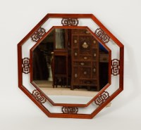 Lot 131 - CHINESE WOOD MIRROR of octagonal form and with...
