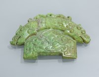 Lot 146 - CHINESE AMULET likely green jade, modelled...