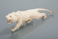 Lot 214 - JAPANESE IVORY CARVING OF A TIGER in a...