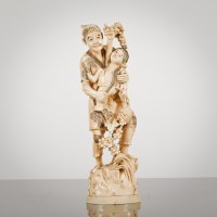 Lot 4 - JAPANESE IVORY OKIMONO carved as a child with...