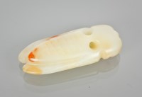 Lot 70 - CHINESE JADE CICADA in celadon and russet...