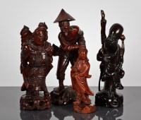 Lot 123 - FOUR CHINESE CARVED WOOD FIGURES comprising a...