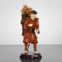 Lot 167 - JAPANESE IVORY AND WOOD FIGURE OF A PEASANT...