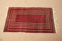 Lot 381 - MODERN BOKHARA RUG with rows of star and cross...