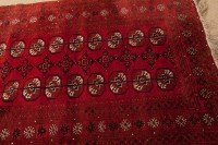 Lot 383 - BOKHARA RUG with two rows of gul, within a...