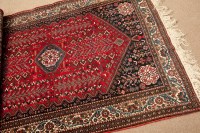Lot 388 - MODERN KASHQAI RUG the lozenge shaped claret...