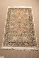 Lot 457 - PERSIAN SILK RUG the ivory field with...