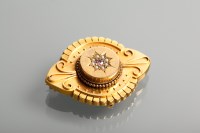 Lot 1108 - VICTORIAN BROOCH set with a central pink stone...