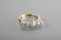 Lot 1109 - EDWARDIAN DIAMOND FIVE STONE RING set with...