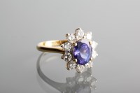 Lot 1123 - TANZANITE AND DIAMOND CLUSTER RING the central...