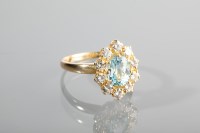 Lot 1138 - AQUAMARINE AND DIAMOND CLUSTER RING set with...