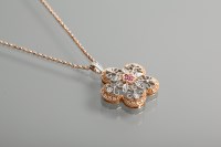 Lot 1149 - DIAMOND SET PENDANT of pierced floral motif...