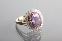 Lot 1182 - AMETHYST AND DIAMOND CLUSTER RING set with a...