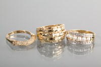 Lot 1189 - THREE NINE CARAT GOLD DRESS RINGS comprising...