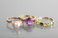 Lot 1190 - THREE NINE CART GOLD GEM SET RINGS comprising...