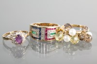 Lot 1191 - THREE NINE CARAT GOLD GEM SET RINGS comprising...