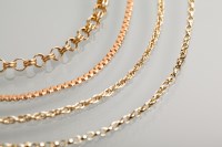 Lot 1218 - GROUP OF THREE GOLD CHAIN NECKLACES AND A...