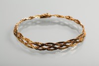 Lot 1219 - NINE CARAT GOLD WOVEN CHAIN BRACELET formed...