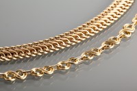 Lot 1229 - TWO NINE CARAT GOLD BRACELETS one formed by...