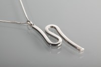 Lot 1231 - TWO CONTEMPORARY WHITE GOLD PENDANTS each on a...