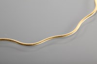 Lot 1232 - UNUSUAL NINE CARAT GOLD CHAIN of waved form