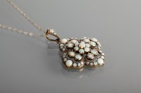 Lot 1235 - EDWARDIAN OPAL SET PENDANT of quatrefoil form,...