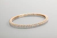 Lot 1237 - NINE CARAT GOLD GEM SET BANGLE set with...