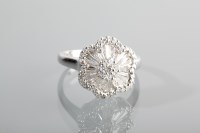 Lot 1241 - ORNATE DIAMOND CLUSTER RING the daisy motif...