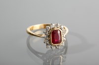 Lot 1242 - RUBY AND DIAMOND DRESS RING the central...