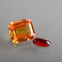 Lot 1262 - UNMOUNTED ORANGE SAPPHIRE the emerald cut...