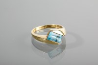 Lot 1267 - NINE CARAT GOLD TOPAZ DRESS RING the emerald...