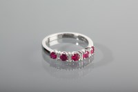 Lot 1268 - RUBY AND DIAMOND DRESS RING with channel set...