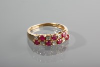 Lot 1276 - RUBY AND DIAMOND DRESS RING with two rows of...