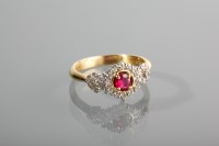 Lot 1279 - RUBY AND DIAMOND DRESS RING the central round...